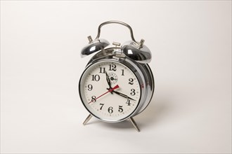 Metal alarm clock with mechanical clockwork and bell mechanism
