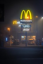 Mc Donalds in the fog at night