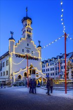 Evening atmosphere at the town hall with Christmas tree