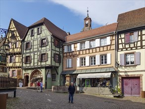 Colourful half-timbered houses and tourists in Rue du General du Gaulle