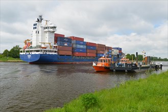 Container ship passing pilot station in Kiel Canal