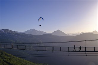 Suspension bridge with paraglider