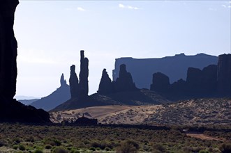 The rock formation Totem Pole with Navajo settlement