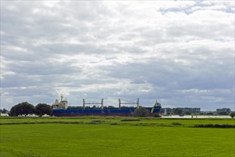 Heavy-lift project carrier on the Weser near Bremen Farge