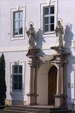 Sculptures of saints at the entrance portal of Frauenwoerth Abbey