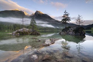 Rocks with trees and fog in Hintersee