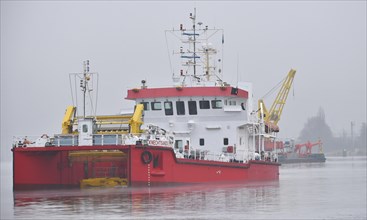 Oil spill response vessel Knechtsand cleans oiled water in the Kiel Canal near Brunsbuettel