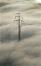 High voltage pylon in fog