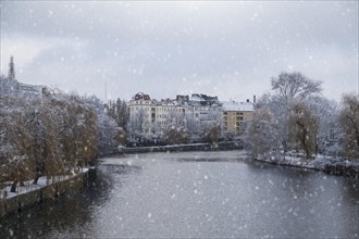 Houses on the banks of the Bundesrat during snowfall