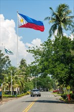 National Flag Flag of Philippines flies on long flagpole in until 1991 former US Naval Base of United States Navy in Subic Bay