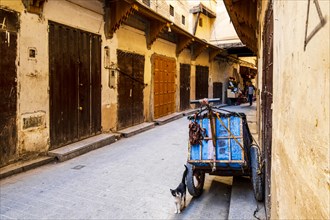 Medieval street with closed souks in Arabic old town called medina in Fes