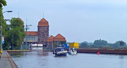 Excursion boat and pleasure boats in front of the shaft lock
