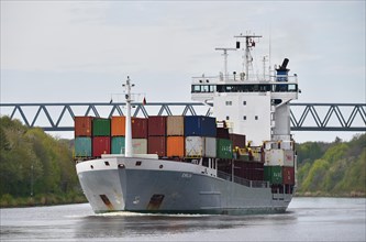 Container ship sailing in the Kiel Canal