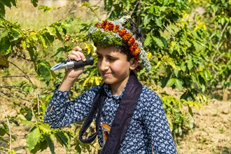 Young boy of the Qahtani Flower men tribe in the coffee plants