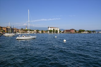 White sailboats on Lake Garda