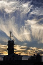Cirrus fibratus clouds and semaphore at the Pointe du Raz