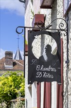 Sign showing silhouette of Impressionist painter Claude Monet at Le Coin des Artistes