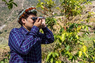 Traditional dressed man of the Qahtani Flower men tribe in the coffee plants