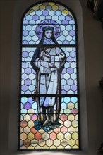 Coloured stained glass window with St. Rosa of Lima in the Church of Our Lady Mariae Namen
