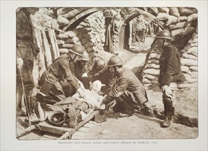 Wounded soldier on stretcher at first aid postin trench in Flanders during the First World War