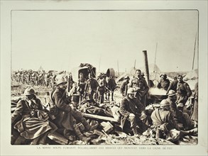 Supply convoy and soldiers drinking soup from field kitchen in Flanders during the First World War