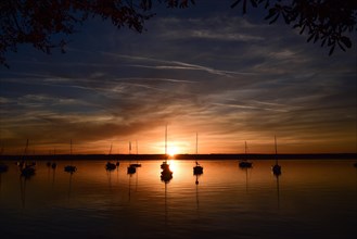 Sailing boats in the sunset in Herrschinger Bucht on Lake Lake Ammer