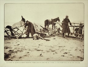 Soldiers examining crashed biplane near De Panne in Flanders during the First World War