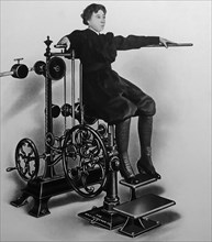 19th century vintage photograph showing woman working on exercising machine by Gustav Zander