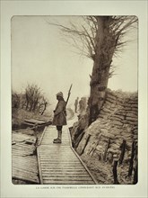 Soldier with rifle on guard duty along the battlefield in Flanders during the First World War