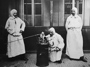 1910 photograph showing mobile disinfection team for disinfecting clothing of emigrants emigrating to the United States in the Antwerp port