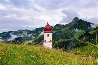 Tower of the village church of St Nicholas in Damuels in the Bregenzerwald