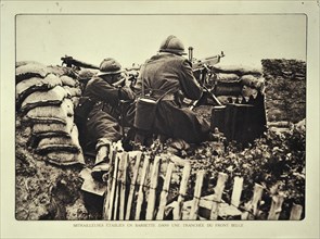 Soldiers in trench shooting with rifle and machine gun in Flanders during the First World War