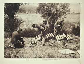 Soldiers collecting cartridge cases