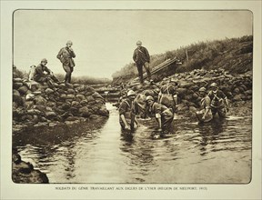 Military engineers repairing dikes along the river Yser