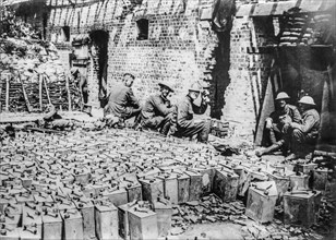 WWI British soldiers with jerrycans at water-filled petrol tin dump at Elverdinghe