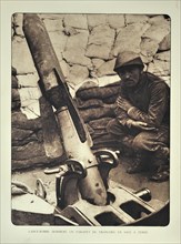 Soldier and trench mortar loaded with bomb in Flanders during the First World War