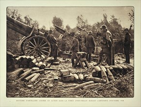 Artillery soldiers firing battery cannons from forest at Houthulst in Flanders during the First World War