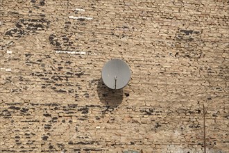 Satellite dish on a wall