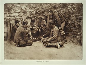 Soldiers at rest playing cards in trench in Flanders during the First World War