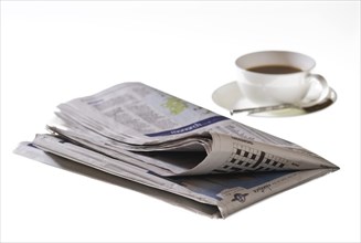 Folded newspaper on white background
