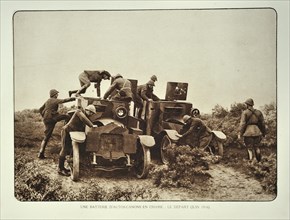 Soldiers and cars fitted with armour and cannons modified into tanks in Flanders during the First World War