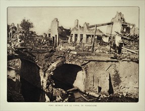 Ruined houses and bridge over the canal at Handzame after bombardment in Flanders during the First World War