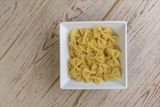 Bowl of uncooked farfalle pasta