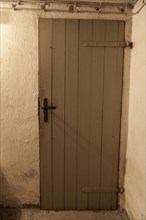 Wooden door in the cellar