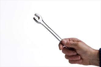 Man holding a chrome plated spanner