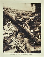 Soldier loading trench mortar with bomb at Diksmuide in Flanders during the First World War