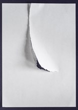 White sheet of paper with a tear
