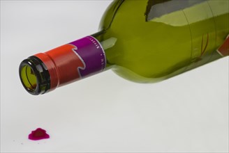 Empty wine bottle lying on its side