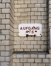 Signpost on the facade of an old factory