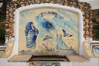 Historic fountain with azulejos tiles in Carvoeiro